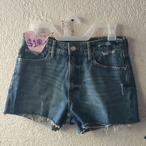 Blue denim jean shorts, rip designs, size 4.